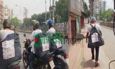 মোটরসাইকেল যোগে নিম্নমধ্যবিত্তদের খাবার দিচ্ছে অরেঞ্জ আর্মি বিডি